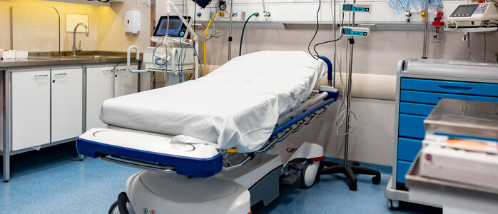 Empty hospital emergency room bed.